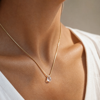 Teardrop Rock Crystal Necklace worn with a white top